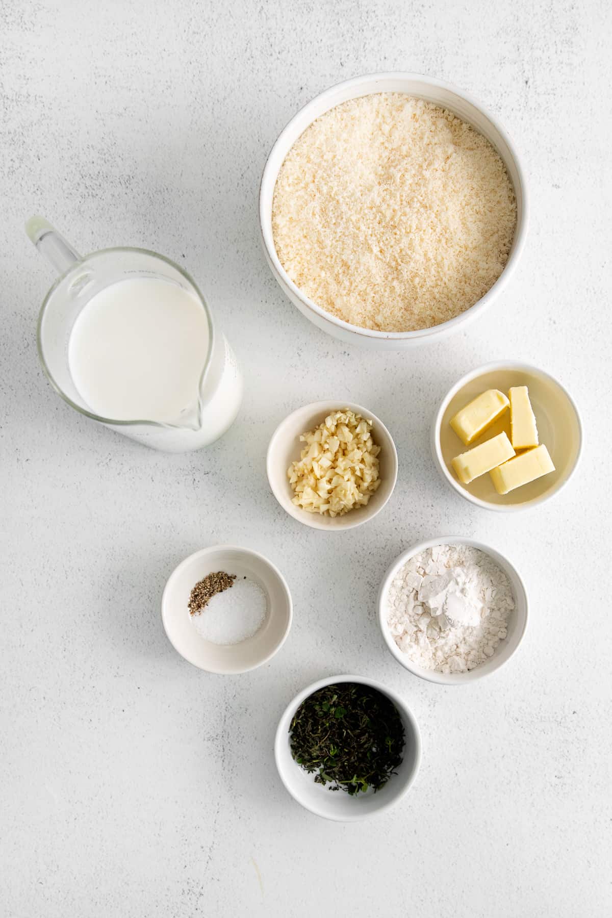 Small bowls of garlic parmesan ingredients. 