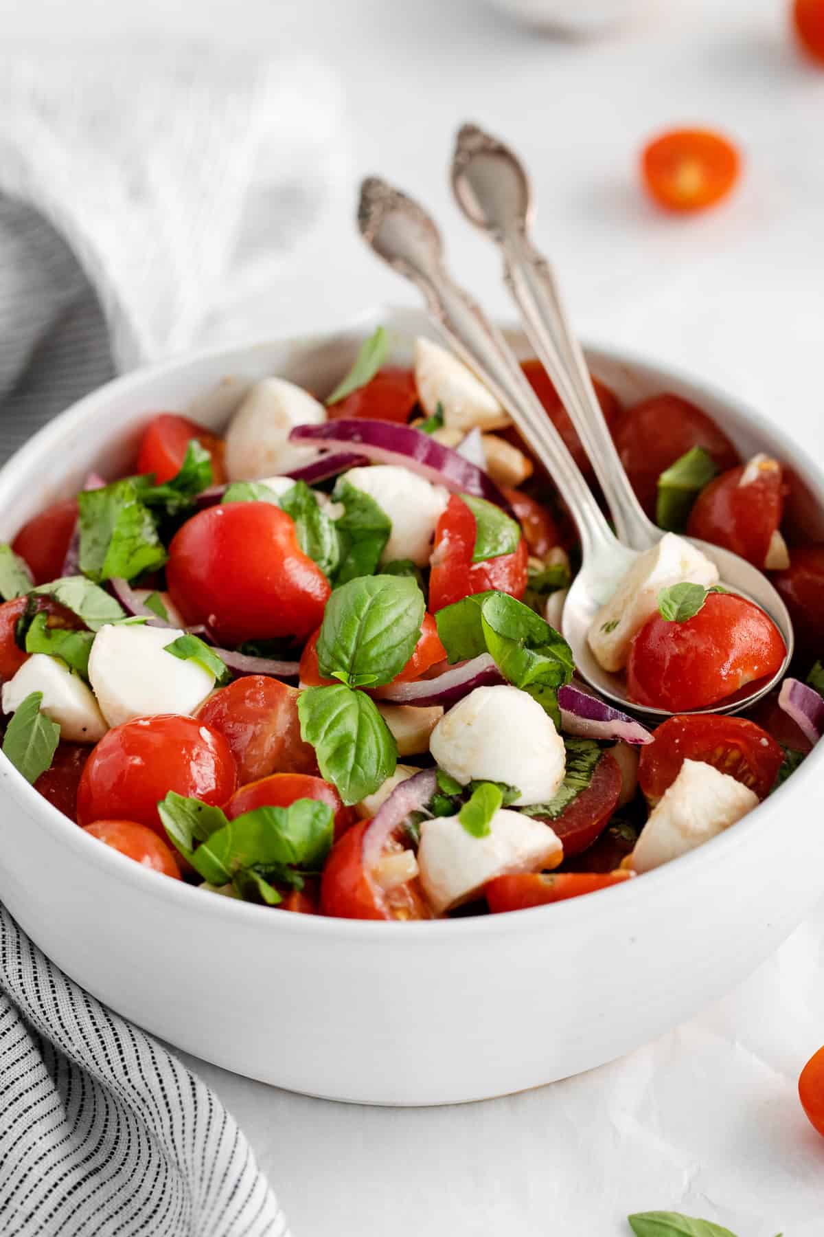 tomato basil and mozzarella salad in bowl.