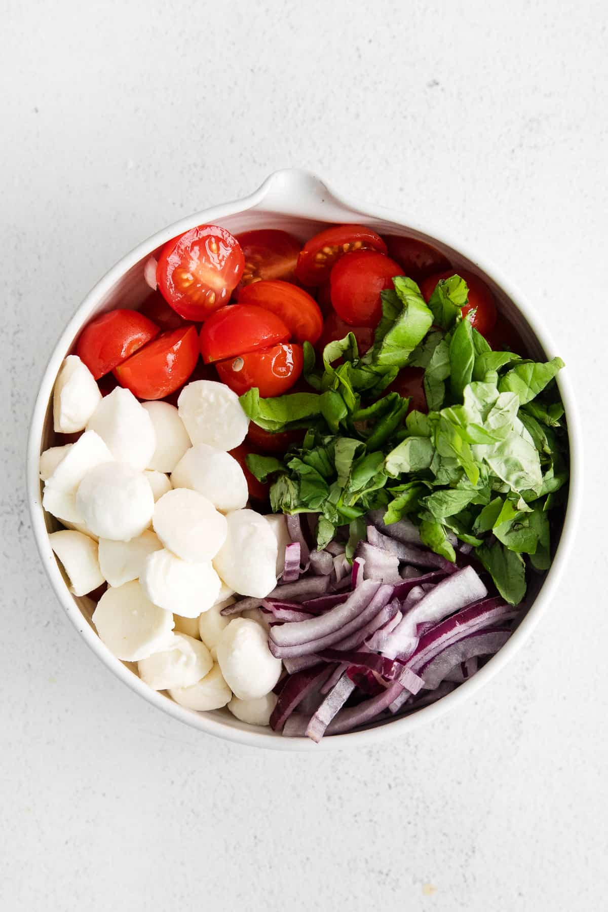 tomato basil mozzarella salad in bowl.