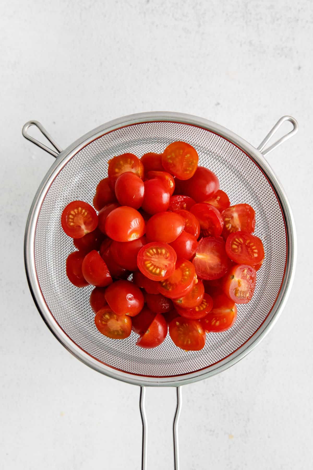 tomatoes in strainer.