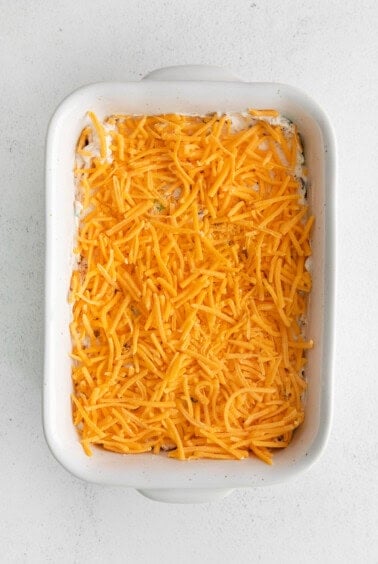 cheesy casserole in a white baking dish.