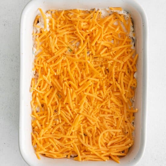 cheesy casserole in a white baking dish.