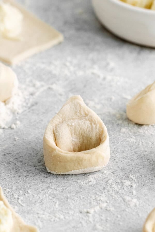 tortellini on cutting board