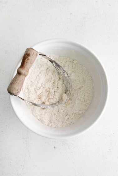 cutting butter into dough.
