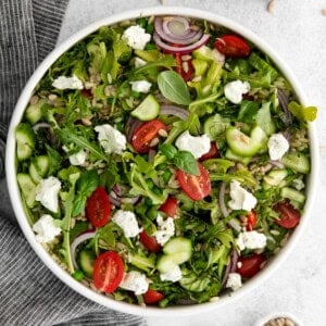 Lemon orzo salad with goat cheese in a salad bowl.