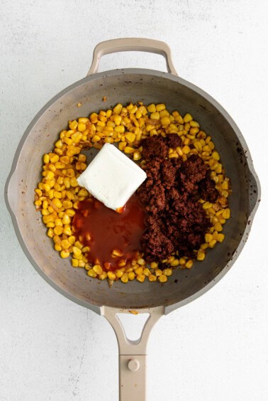 adding cheese to skillet.