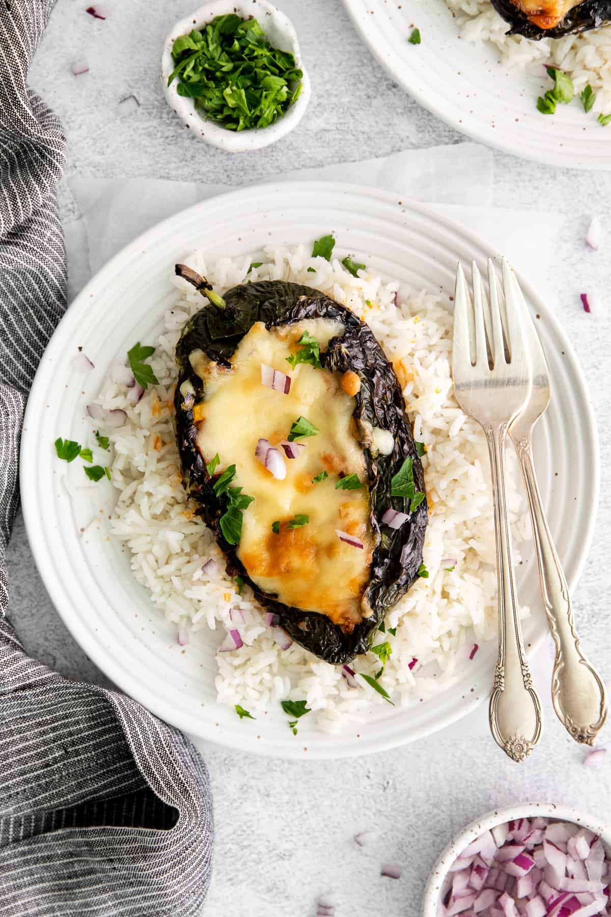 Stuffed poblano pepper served over white rice. 