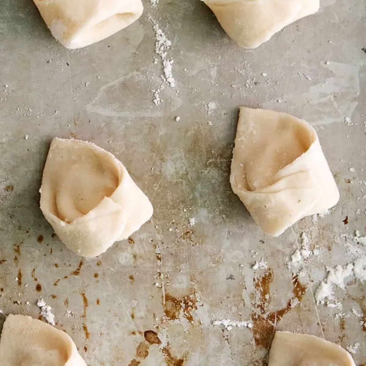 Cheese tortellinis on a pan.