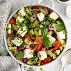 Cucumber tomato feta salad in a salad bowl.