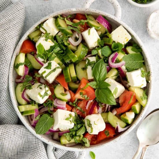 Cucumber tomato feta salad in a salad bowl.