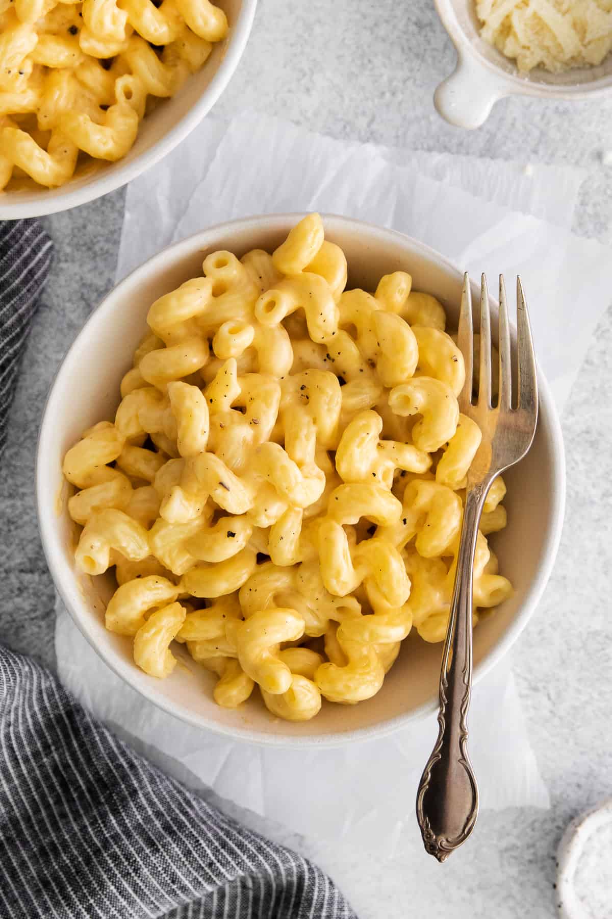 Easy cheese pasta in a bowl topped with black pepper.