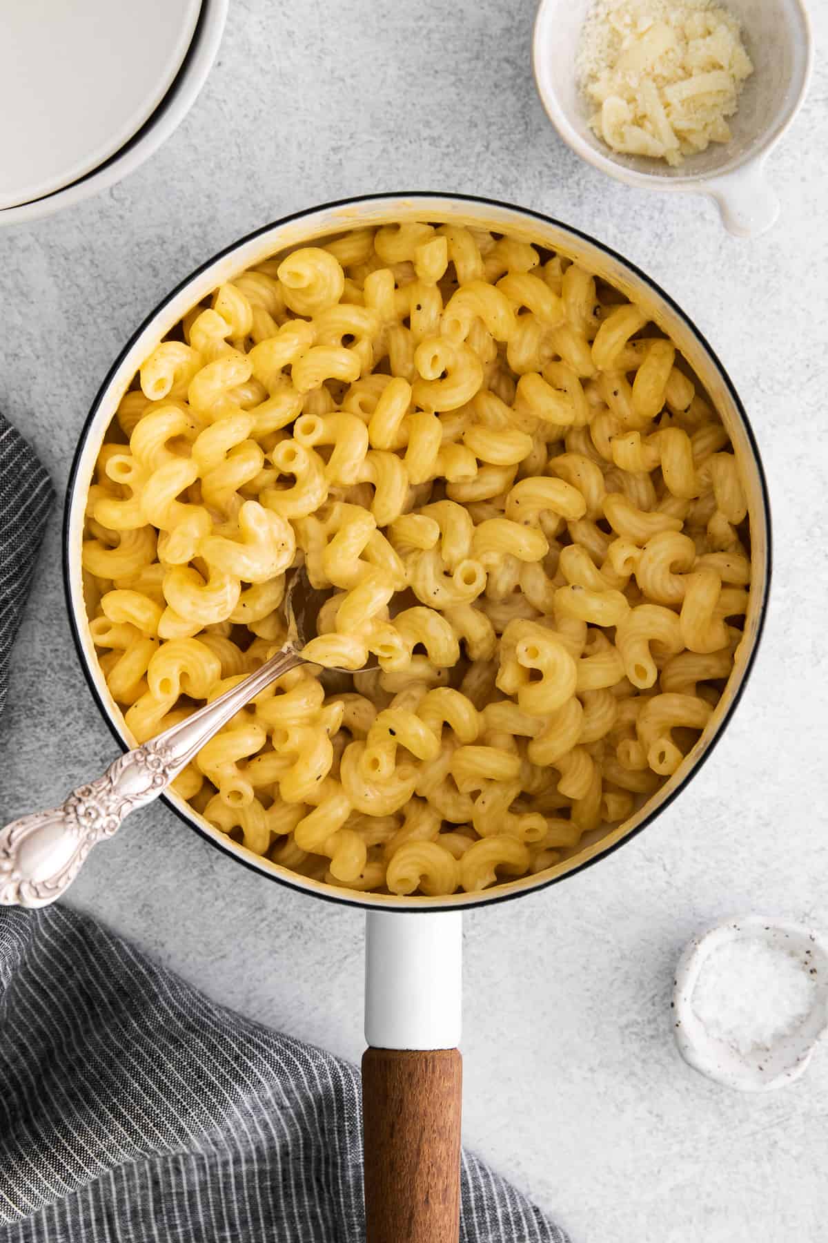 Easy cheese pasta in a stock pot with a spoon.