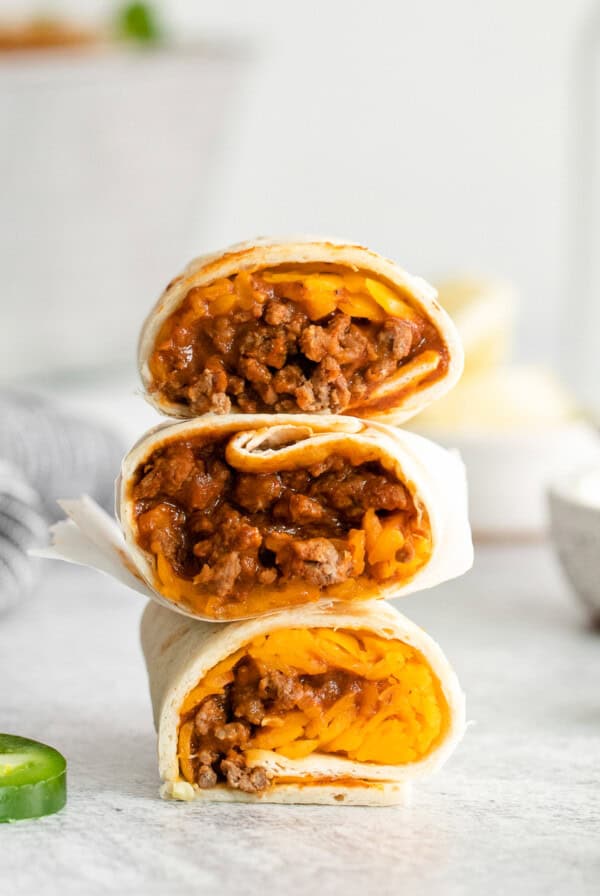 stack of 3 burritos cut in half.