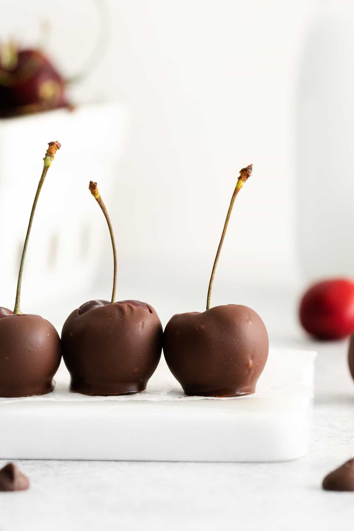 Chocolate covered cherries on a platter. 