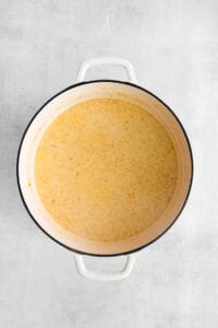 a pot of soup on a white background.