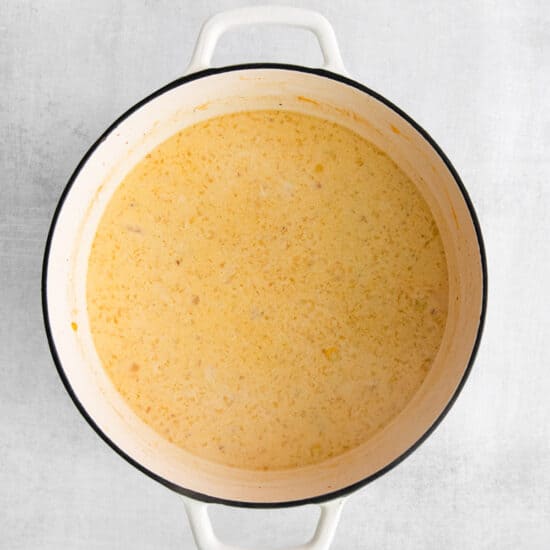 a pot of soup on a white background.