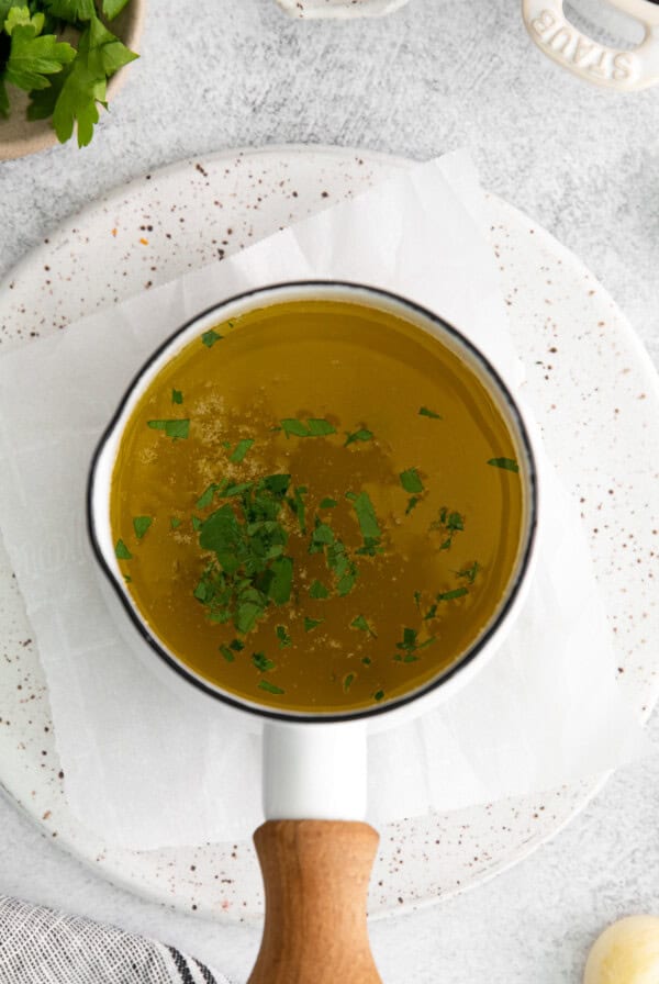 Garlic butter sauce with fresh parsley.