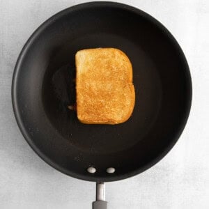 a toasted piece of bread in a frying pan.