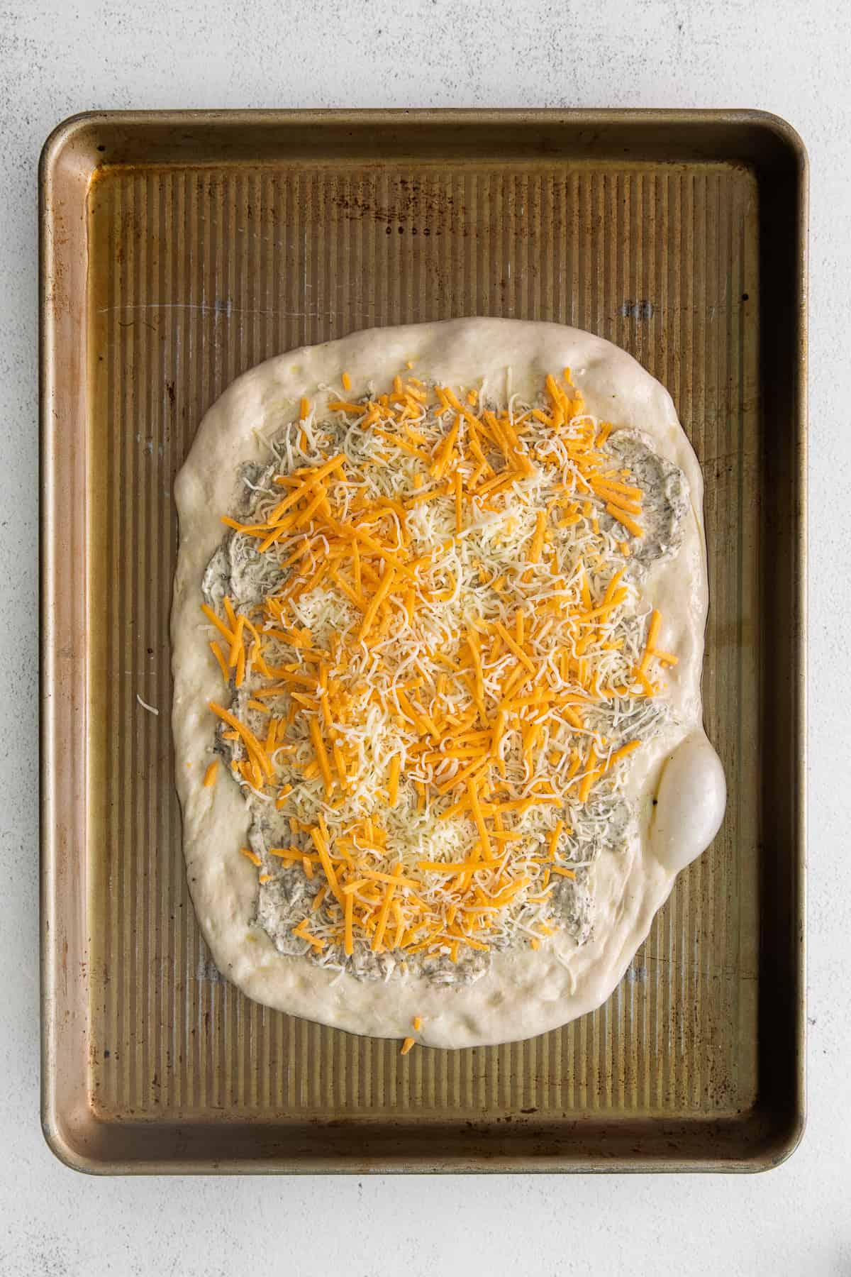cheese on pizza crust.