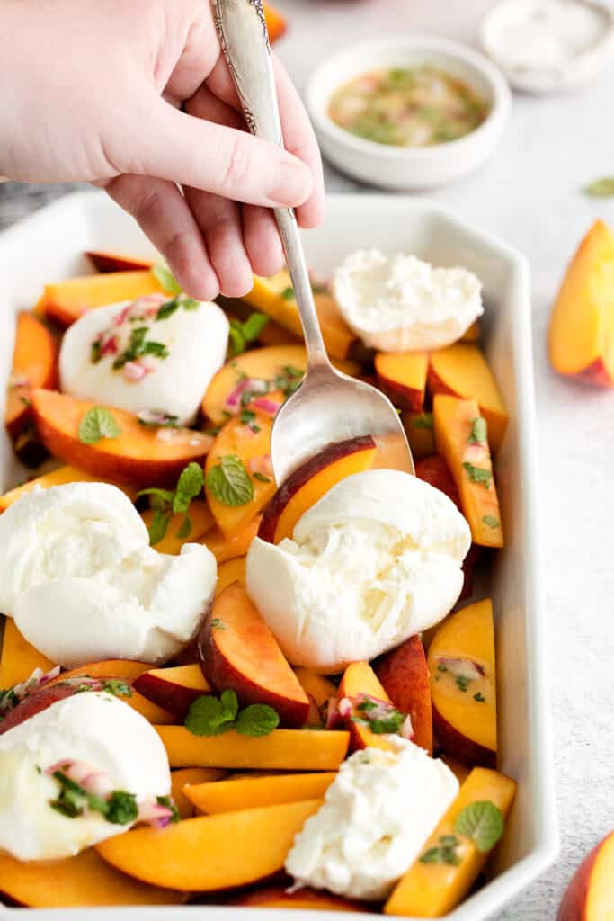 peach burrata salad in platter.