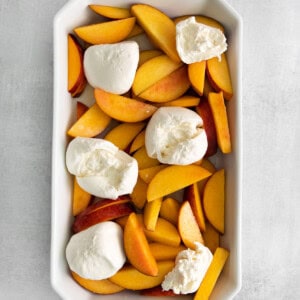 peaches and burrata in dish.