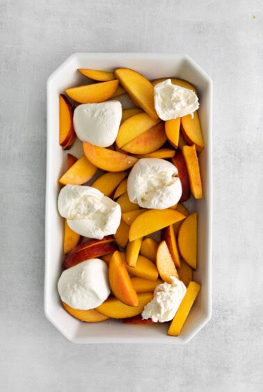 peaches and burrata in dish.