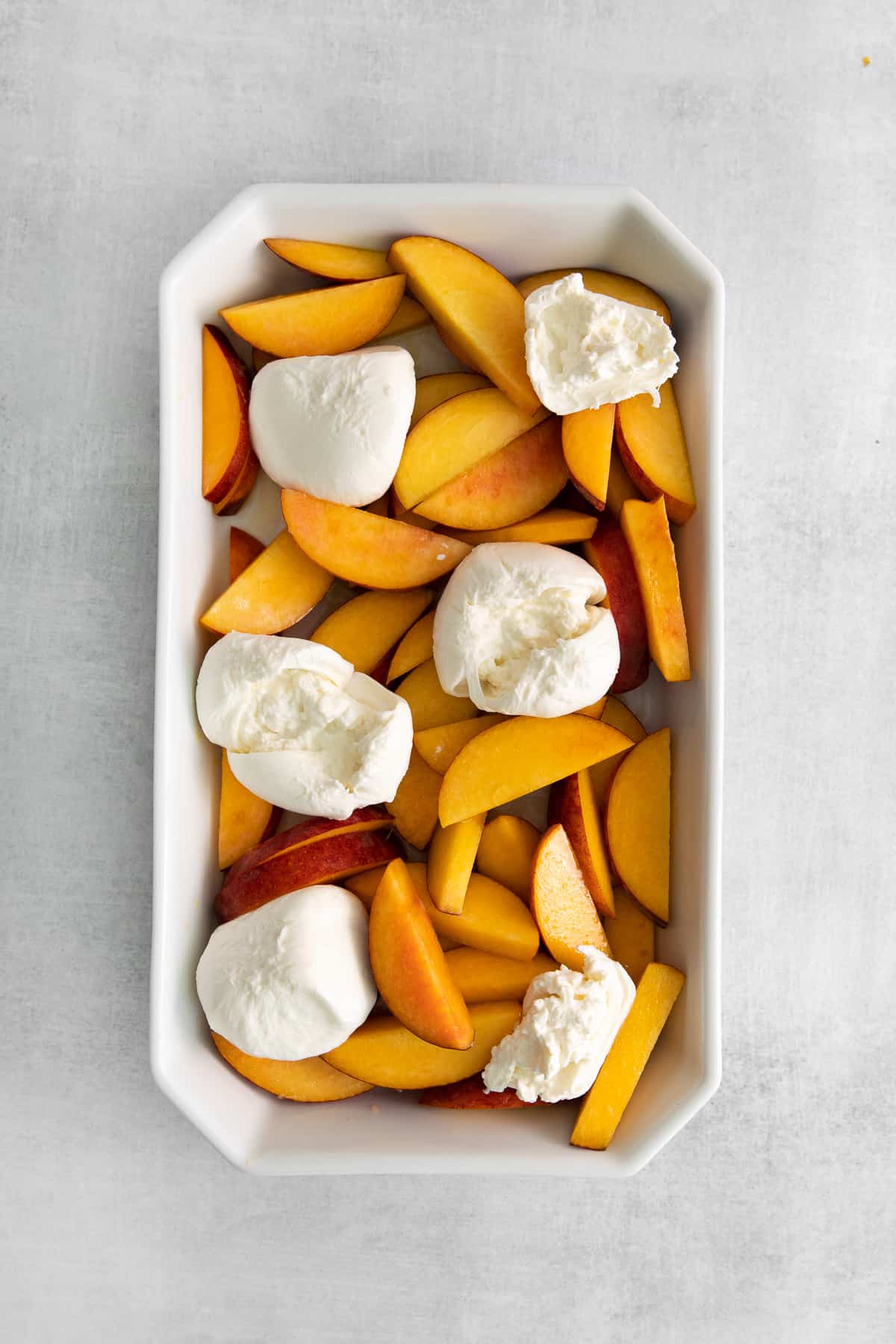 sliced peaches and burrata cheese.