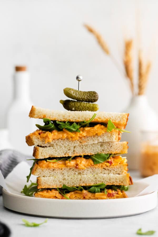 A stack of pimento cheese sandwiches.