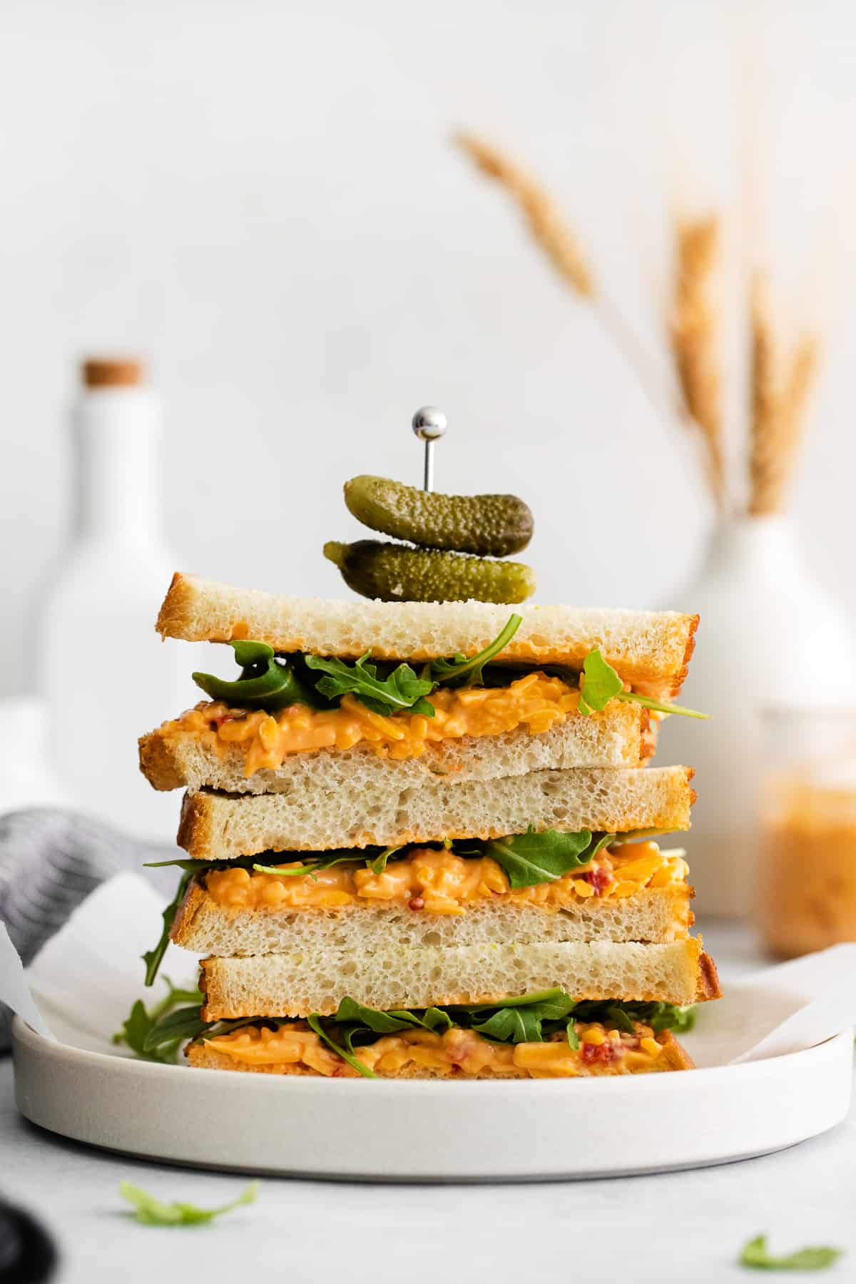 A stack of pimento cheese sandwiches.