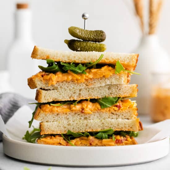 A stack of pimento cheese sandwiches.