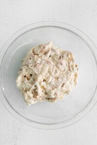 a clear glass plate with a bowl of mashed potatoes.