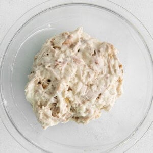 a clear glass plate with a bowl of mashed potatoes.