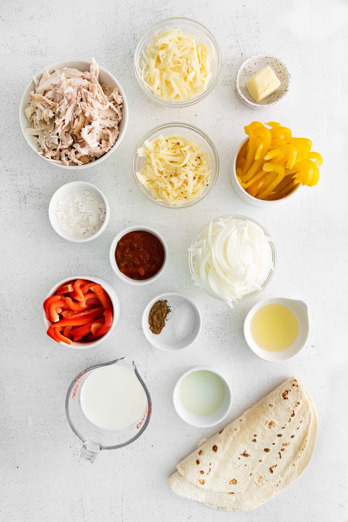 Ingredients for chicken quesadillas in bowls.