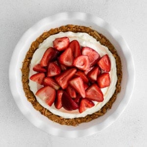 a strawberry cream cheese pie in a white dish.