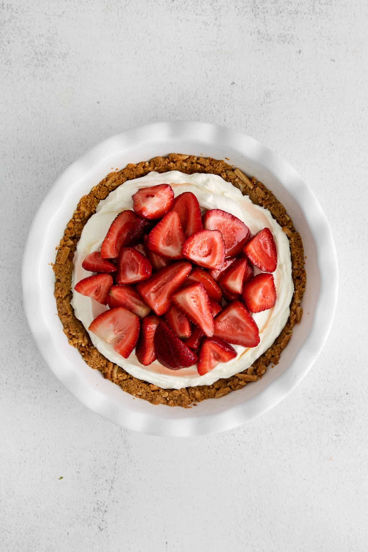 Cream cheese pie topped with strawberries.