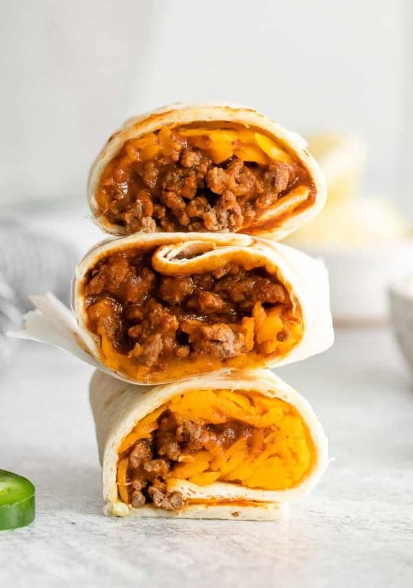 stack of 3 burritos cut in half.