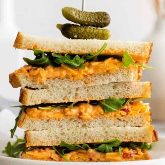 A stack of pimento cheese sandwiches.