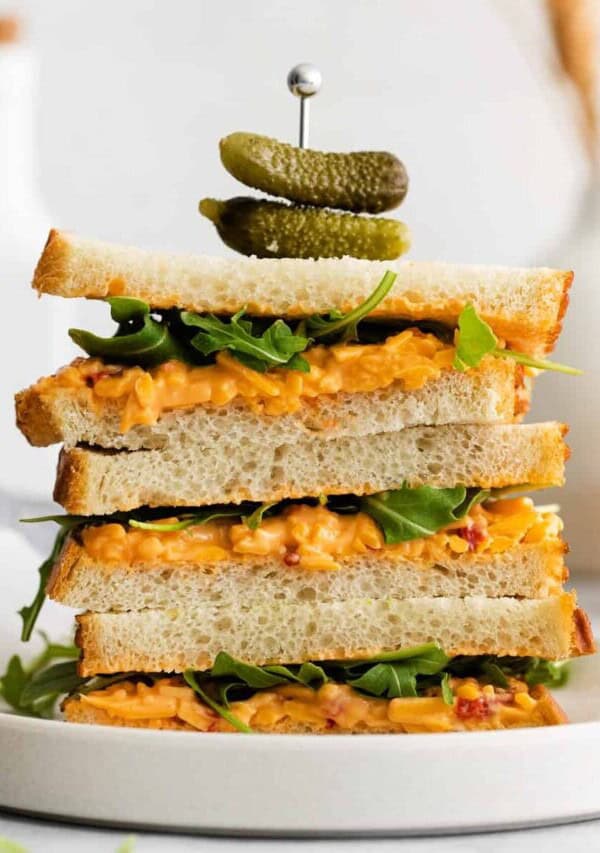 A stack of pimento cheese sandwiches.