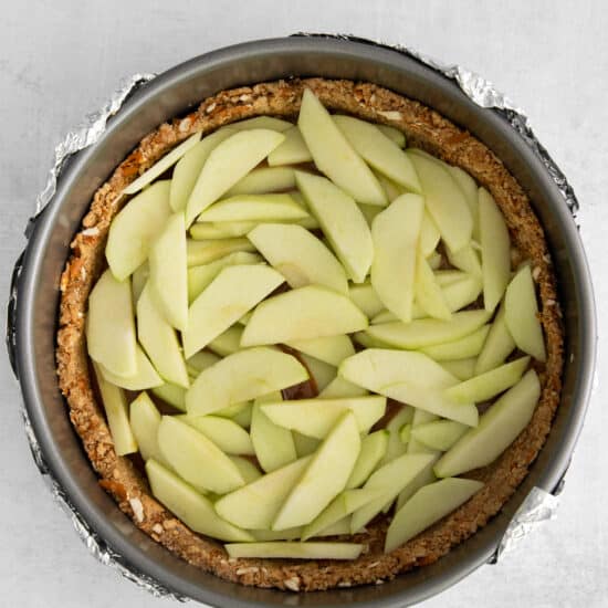an apple pie is in a metal pan.