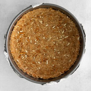 a pie crust in a pie pan on a table.