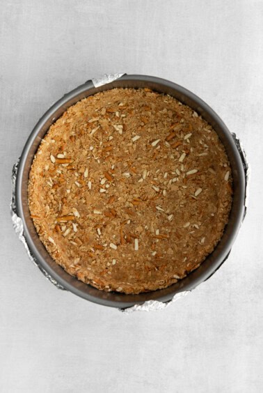 a pie crust in a pie pan on a table.