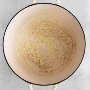 a pan filled with food on a white background.