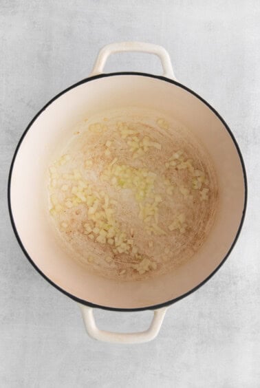 a pan filled with food on a white background.