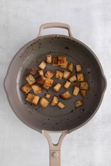 a frying pan with a piece of bread in it.