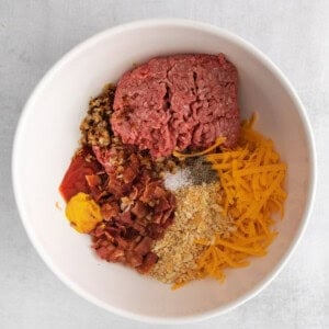 meatball ingredients in a bowl on a white background.