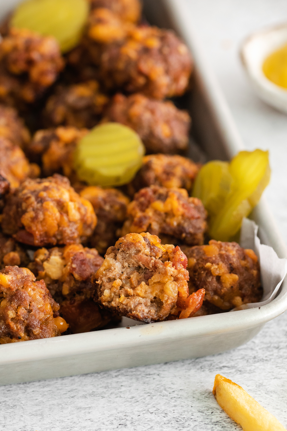 Cheeseburger meatballs with pickles.