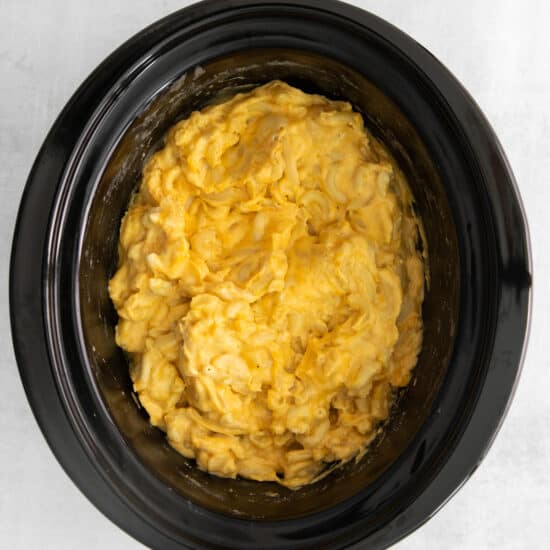 a crock pot filled with mashed potatoes.