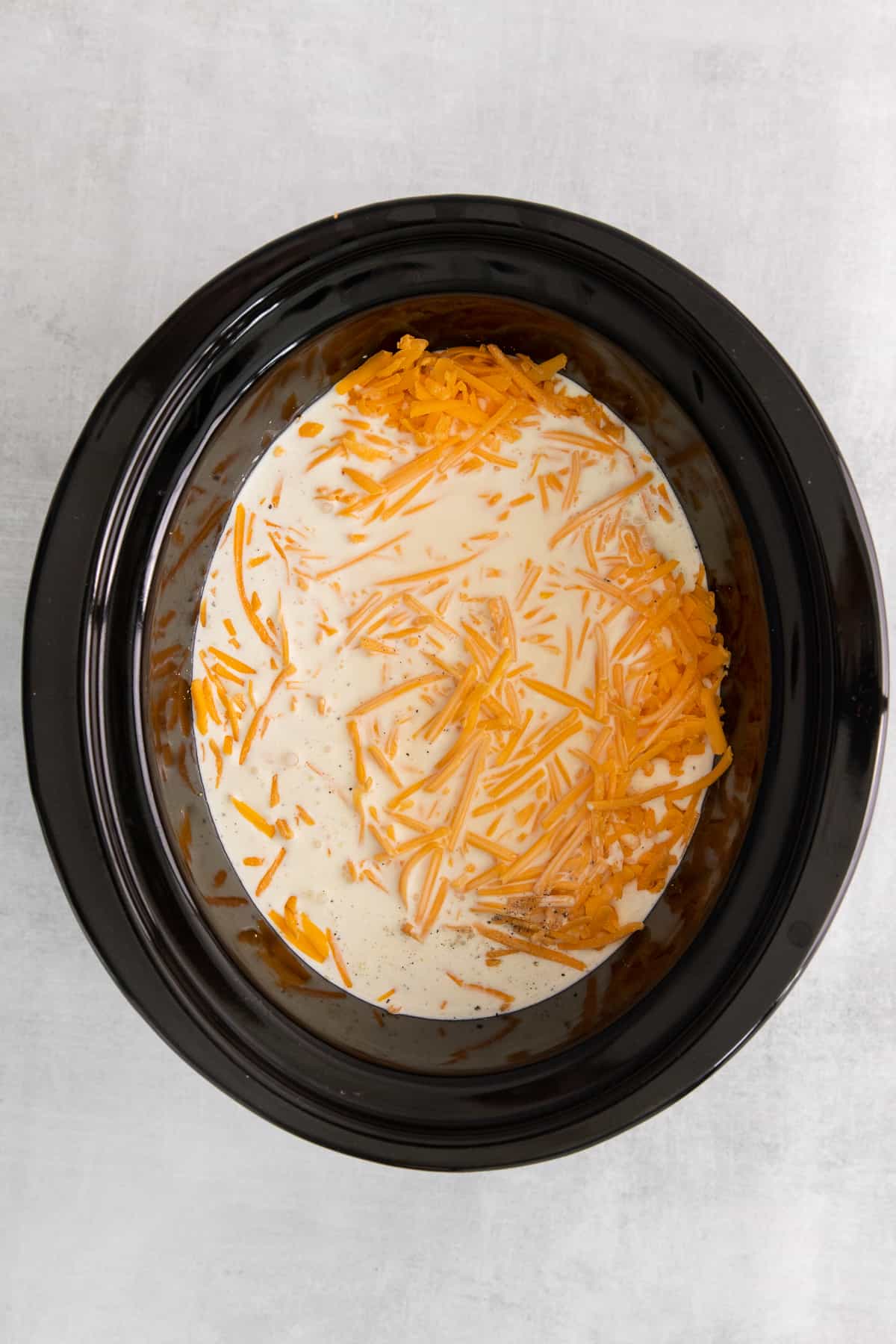 milk and cheese in crock pot.