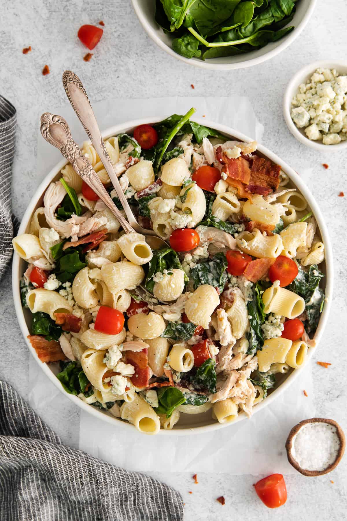 Gorgonzola chicken pasta salad in a bowl with spoons.