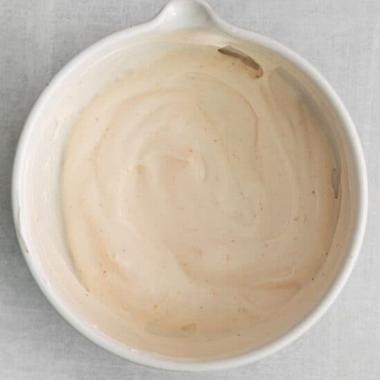 Seasoned sour cream in a bowl.